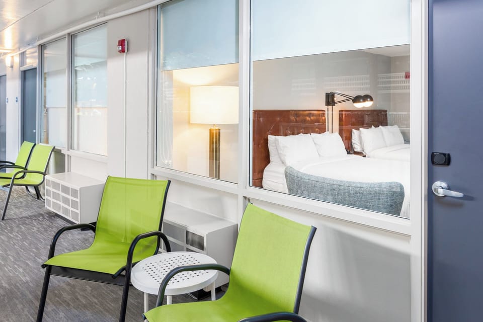 Room, 2 Queen Beds, Pool View | Desk, iron/ironing board, cribs (free), WiFi (free)