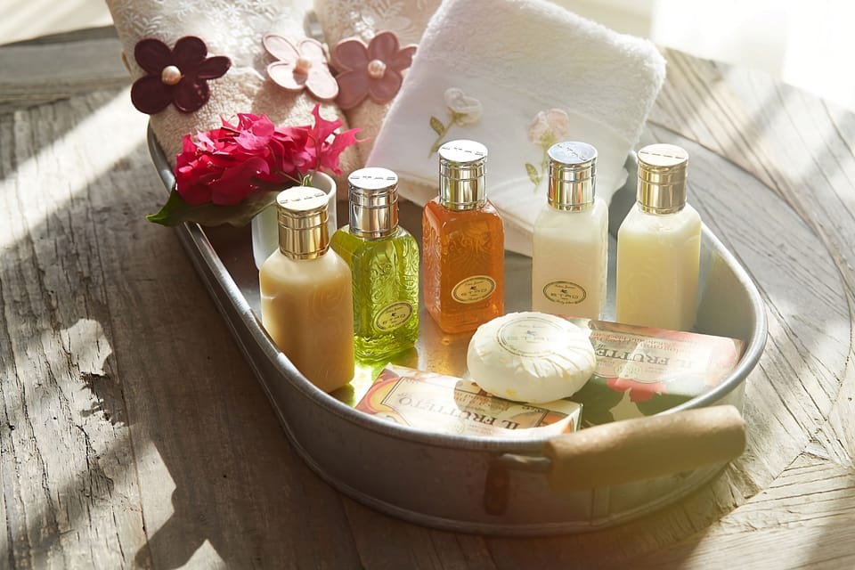 Shower, rainfall showerhead, designer toiletries, hair dryer