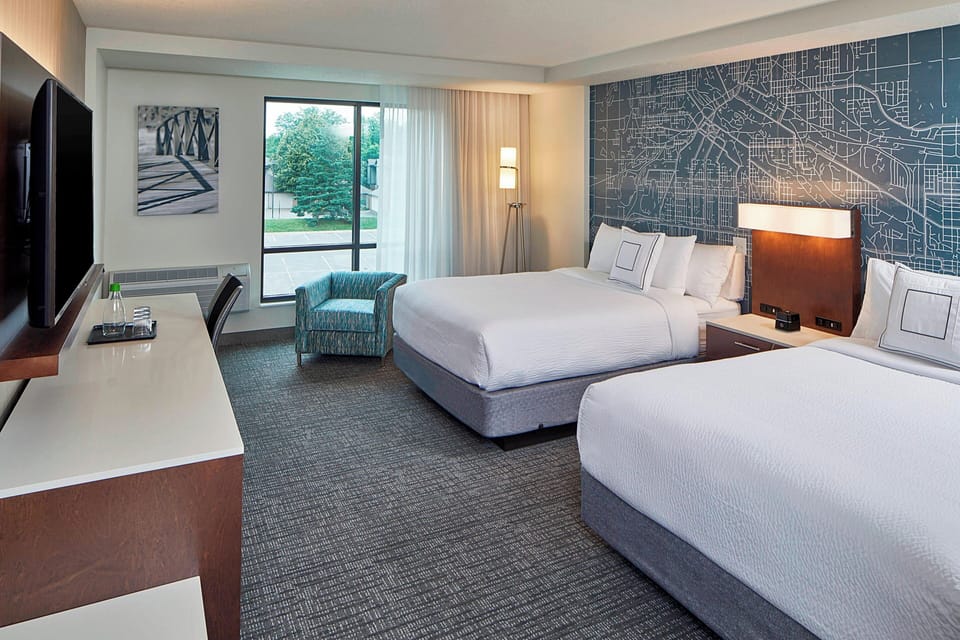 Hypo-allergenic bedding, pillowtop beds, desk, laptop workspace