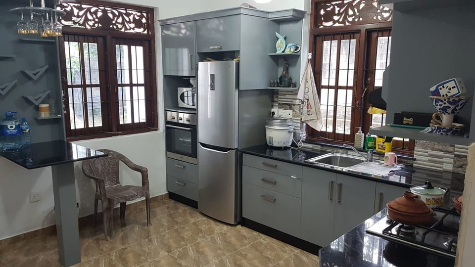 Deluxe Room, 1 Bedroom, Smoking, Garden View | Private kitchen | Shared fridge, electric kettle, highchair