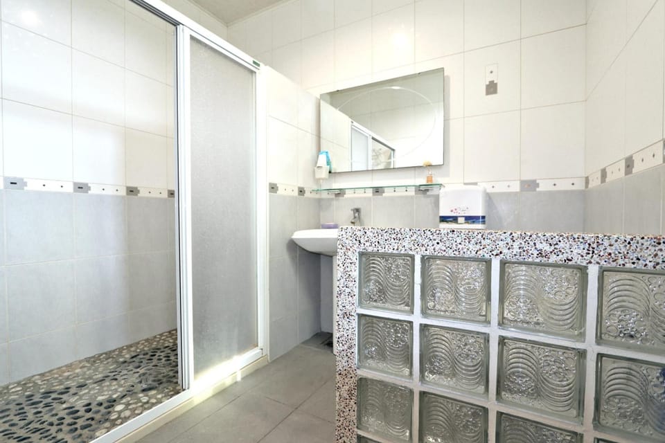 Shower, free toiletries, slippers, towels