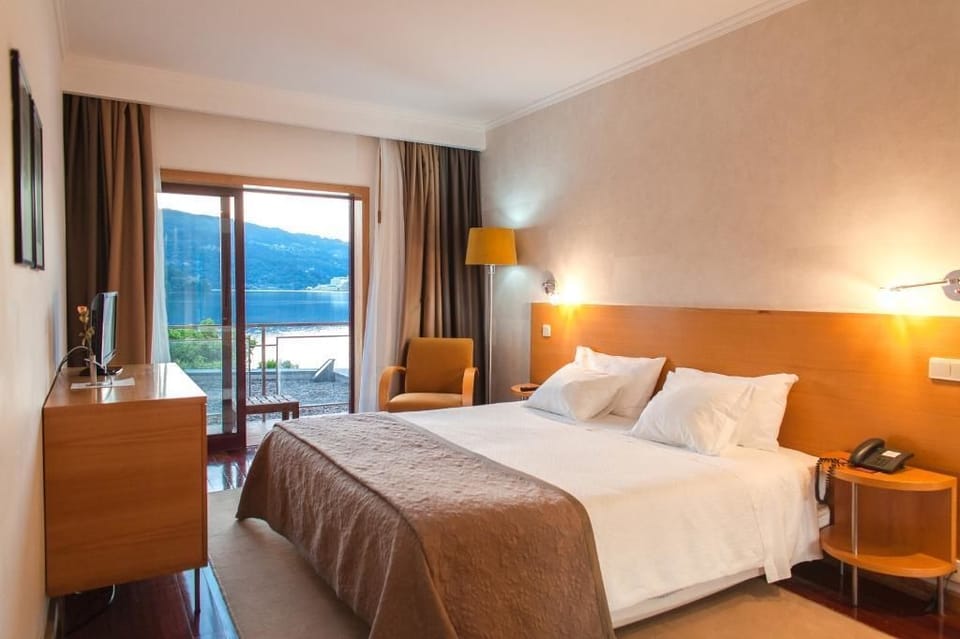 Double Room, River View (Balcony) | Minibar, in-room safe, desk, blackout drapes