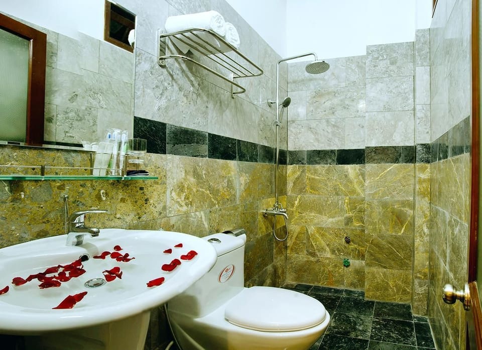 Shower, free toiletries, hair dryer, slippers