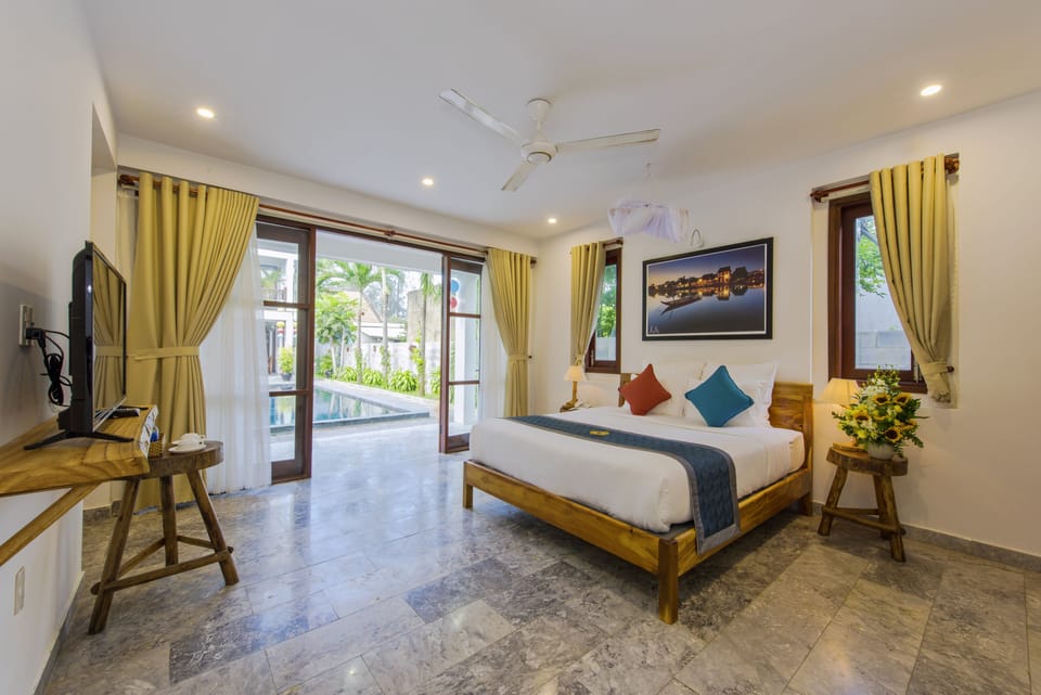 Family Triple Room, Balcony, Garden View | Minibar, in-room safe, desk, soundproofing