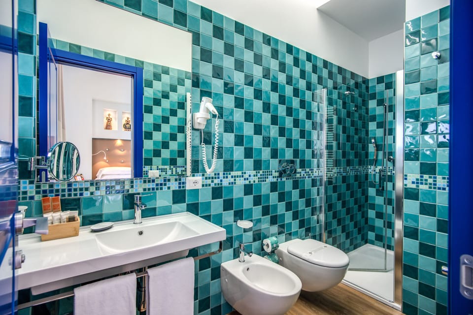 Deluxe Double or Twin Room, Balcony, Sea View | Bathroom | Rainfall showerhead, free toiletries, slippers, bidet