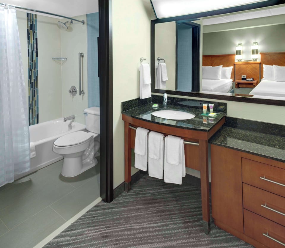 Combined shower/tub, designer toiletries, towels, soap