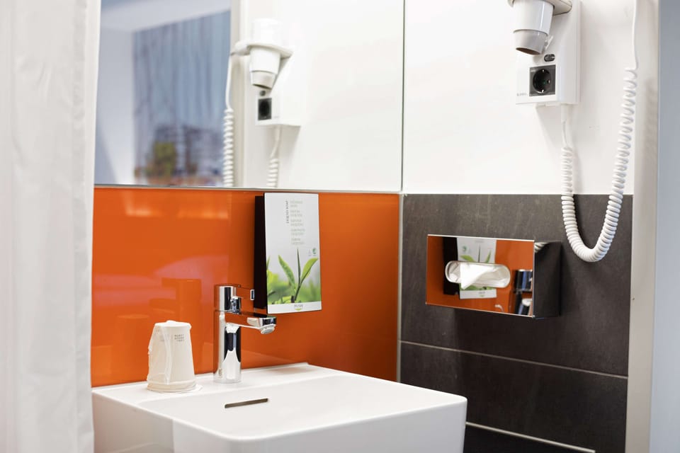Shower, eco-friendly toiletries, hair dryer, towels