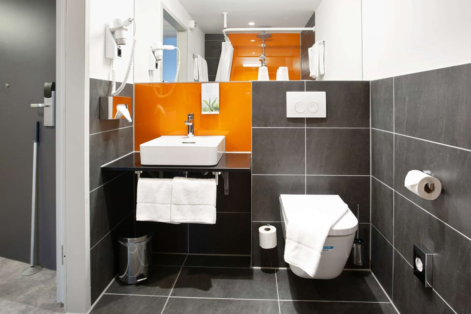Shower, eco-friendly toiletries, hair dryer, towels