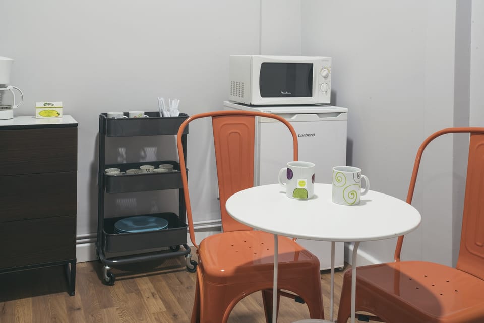 Fridge, microwave, electric kettle, cookware/dishes/utensils