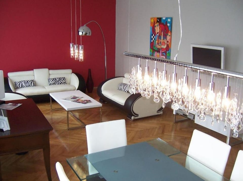 Triple Room | Living area | Flat-screen TV, pay movies