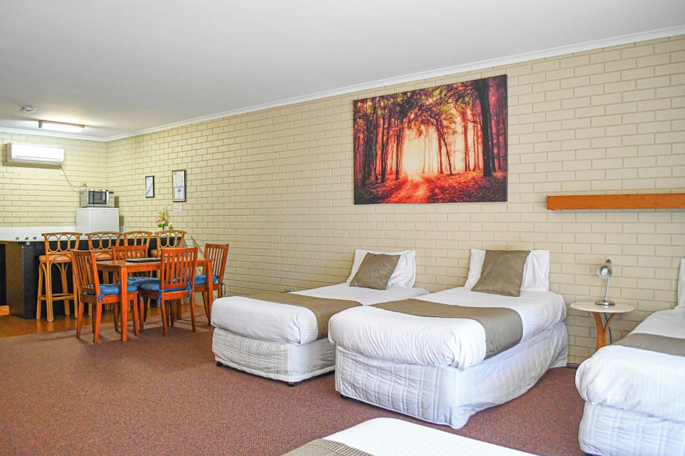 Family Quadruple Room, Non Smoking, Kitchenette (quad share) | Living area | TV