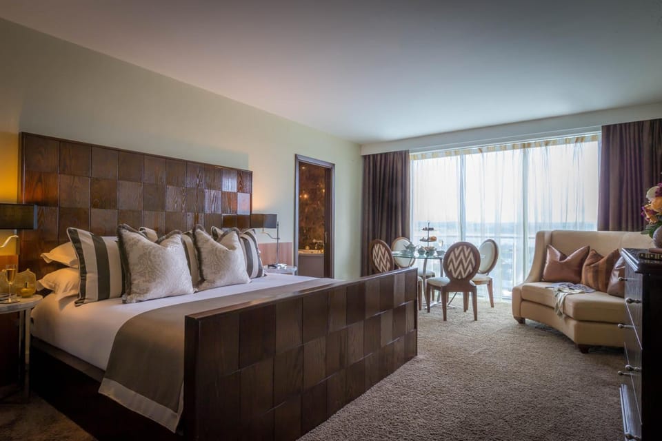 Hypo-allergenic bedding, desk, laptop workspace, blackout drapes