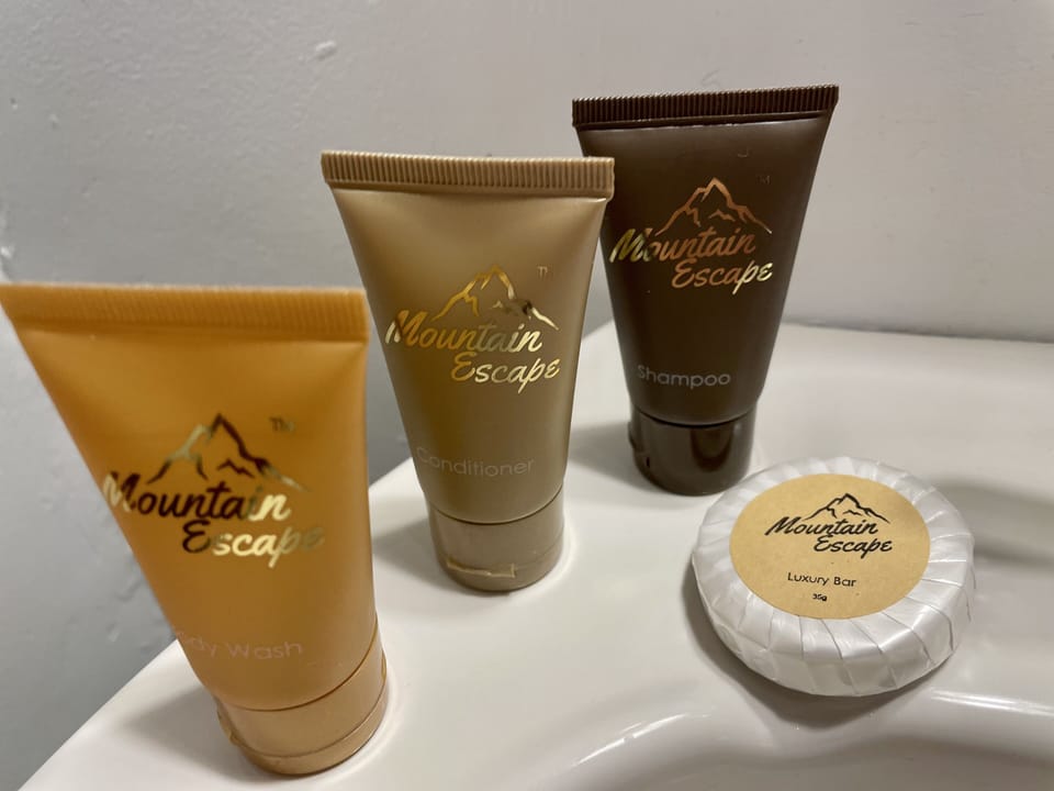 Designer toiletries, hair dryer, towels, soap