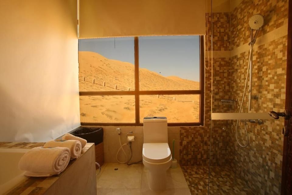 Sand Suite | Bathroom | Shower, slippers, towels, soap