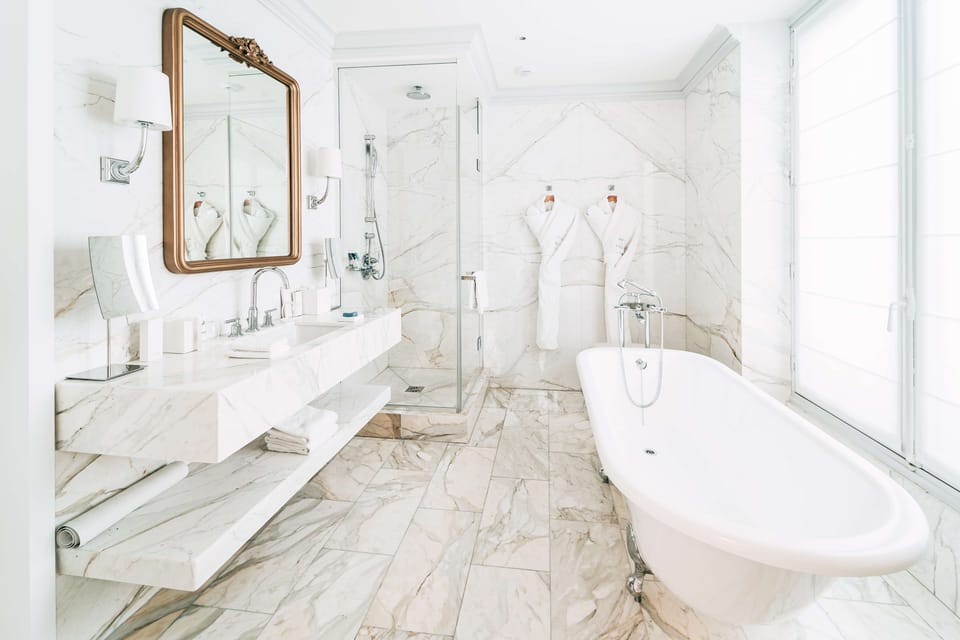 Suite (Pissarro) | Bathroom | Rainfall showerhead, designer toiletries, hair dryer, bathrobes