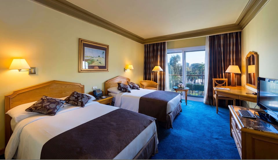 Family Double or Twin Room, 2 Bedrooms, City View | Minibar, in-room safe, individually decorated, individually furnished