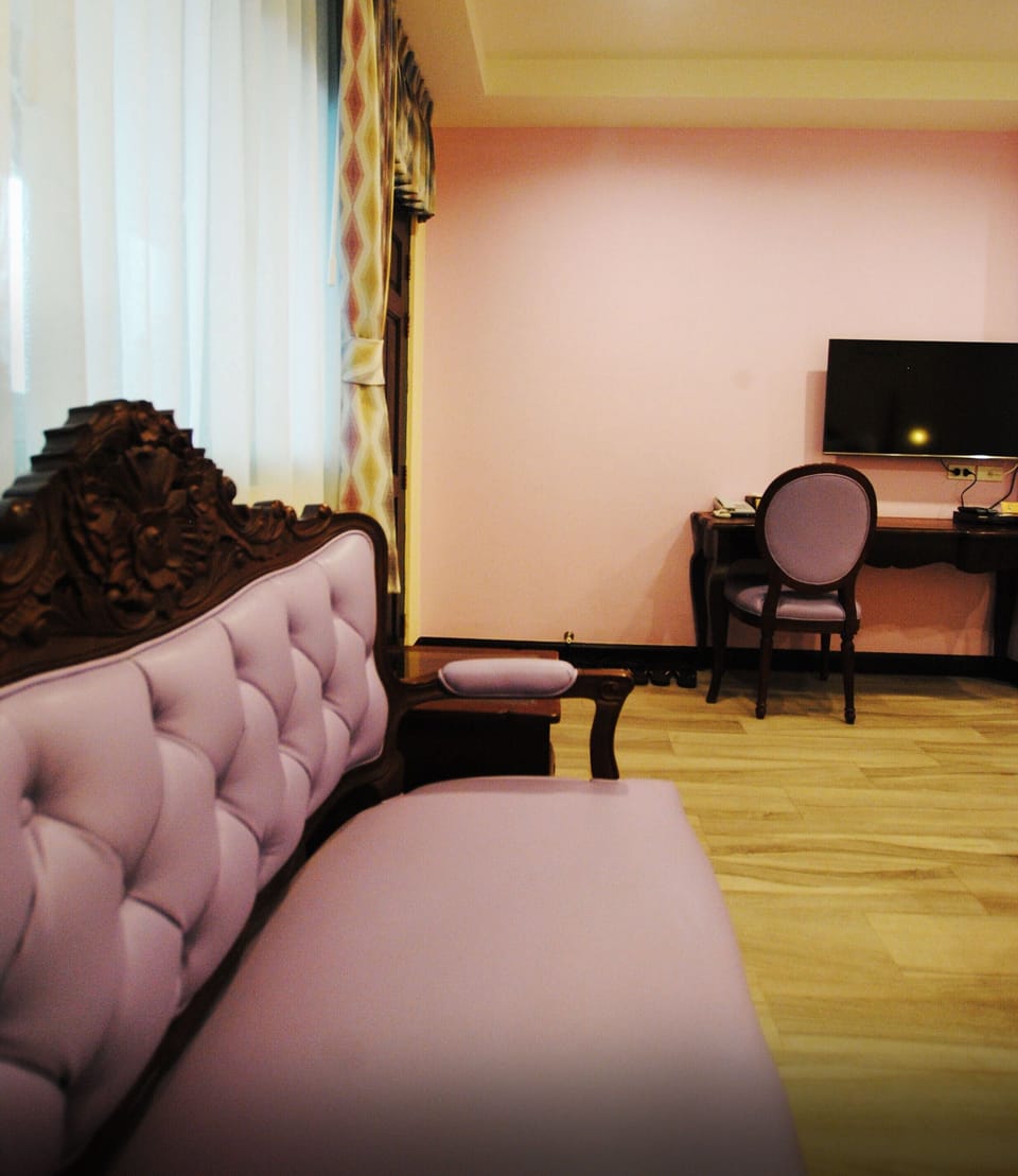Deluxe Triple Room | Minibar, in-room safe, individually decorated, desk