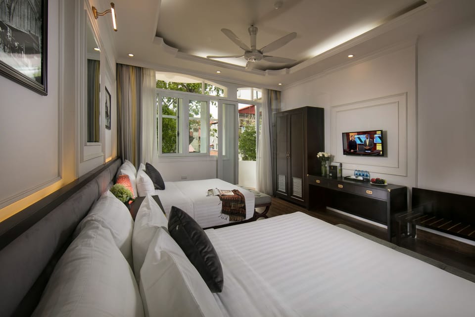 Family Triple Room, 2 Double Beds, Balcony, City View | Premium bedding, minibar, in-room safe, individually decorated