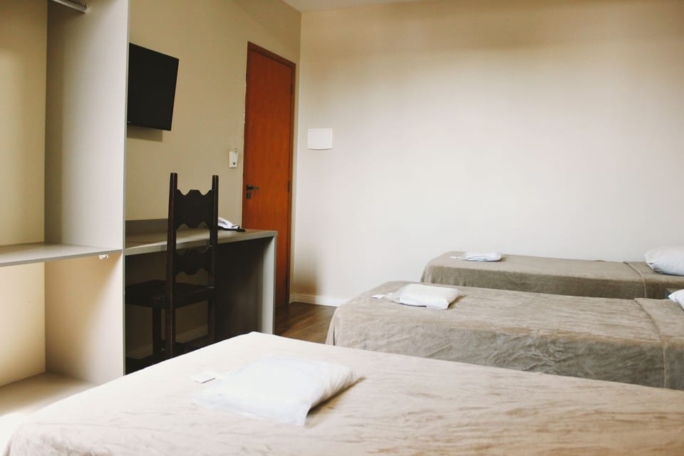 Comfort Triple Room | Blackout drapes, iron/ironing board, free WiFi, bed sheets