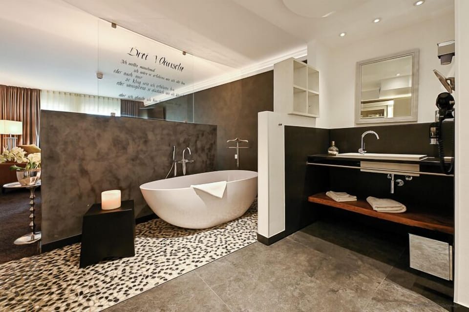 Deluxe Double Room, Bathtub | Bathroom | Deep soaking tub, free toiletries, hair dryer, bathrobes