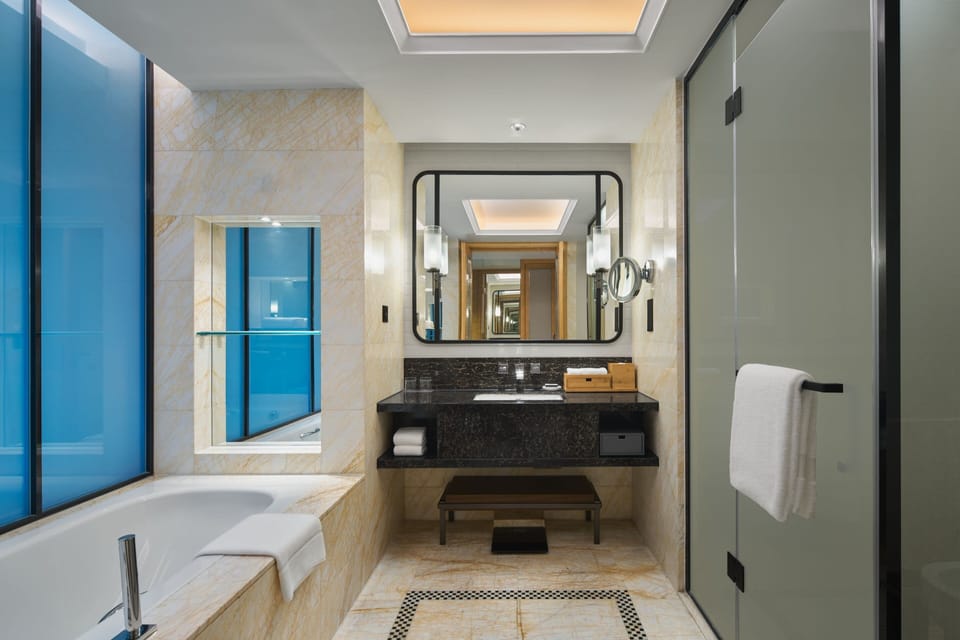 Designer toiletries, hair dryer, bathrobes, slippers