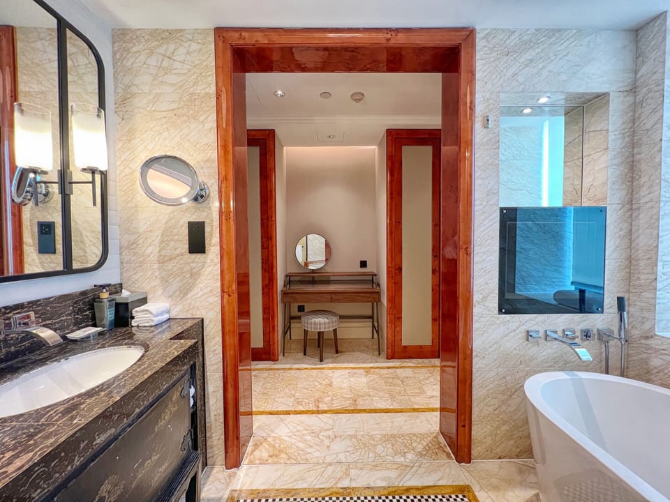 Designer toiletries, hair dryer, bathrobes, slippers