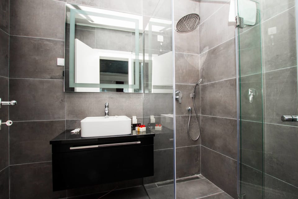 Double Room, 1 Queen Bed with Sofa bed, Balcony, Partial Sea View | Bathroom | Shower, free toiletries, hair dryer, bathrobes