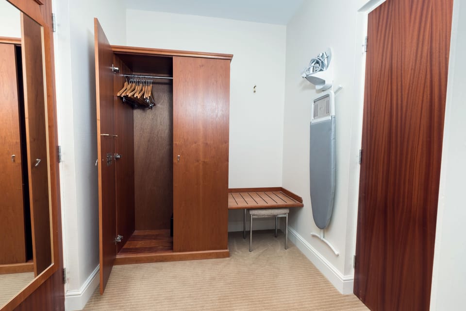 Hypo-allergenic bedding, desk, blackout drapes, iron/ironing board