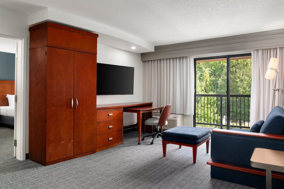 Suite, 1 Bedroom | Living area | 32-inch LCD TV with cable channels, TV