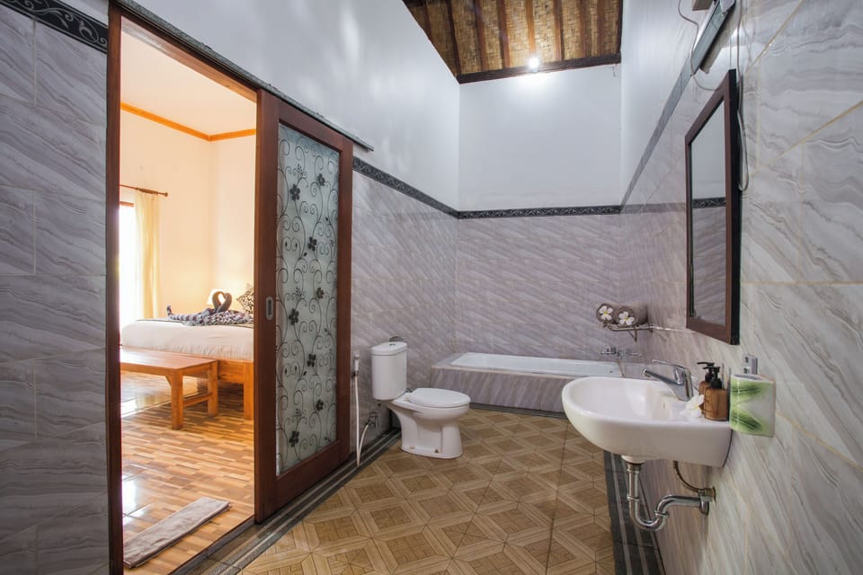Deluxe Villa, 1 King Bed, Pool View | Bathroom | Free toiletries, bathrobes, bidet, towels