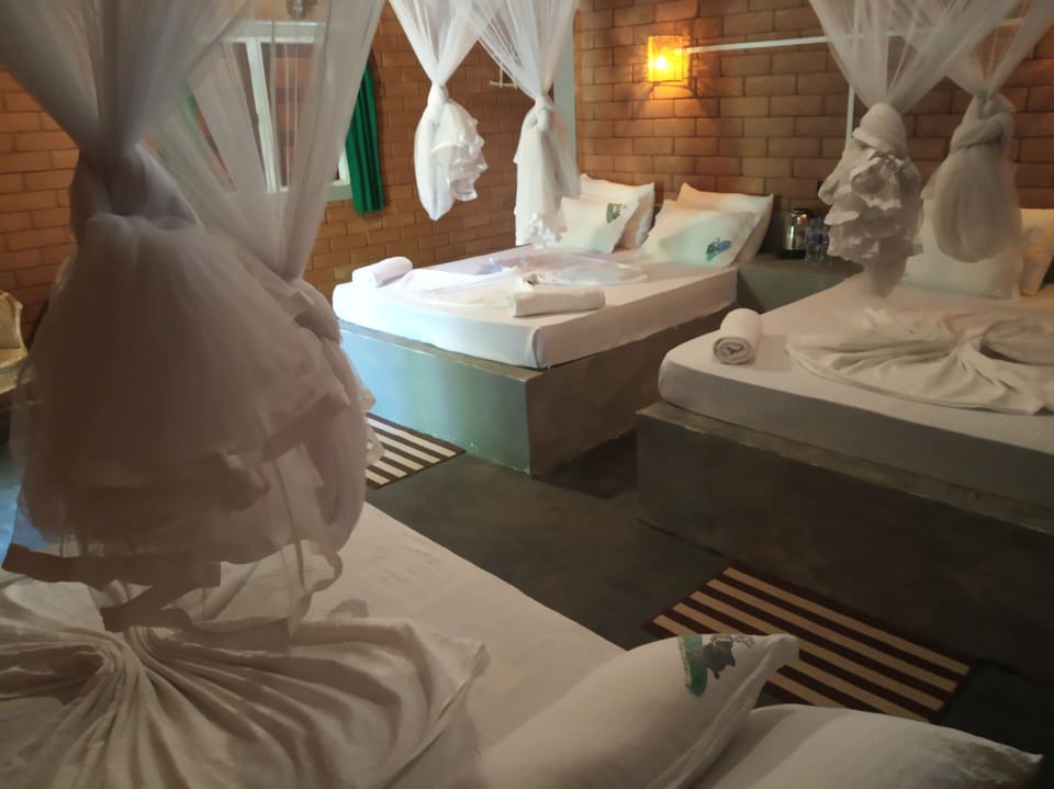Deluxe Family Room | 1 bedroom, in-room safe, individually decorated, individually furnished