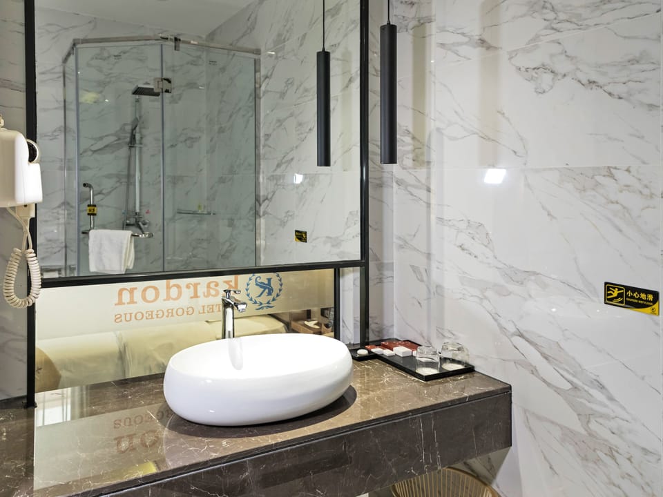 Shower, free toiletries, hair dryer, slippers