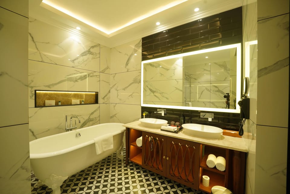Suite, 1 King Bed (Anantara) | Bathroom | Combined shower/tub, eco-friendly toiletries, hair dryer, bathrobes
