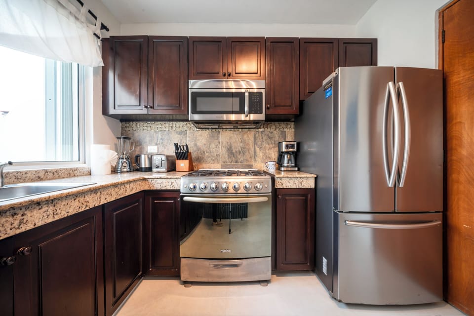 Design Penthouse, 2 Bedrooms | Private kitchen | Fridge, microwave, oven, stovetop