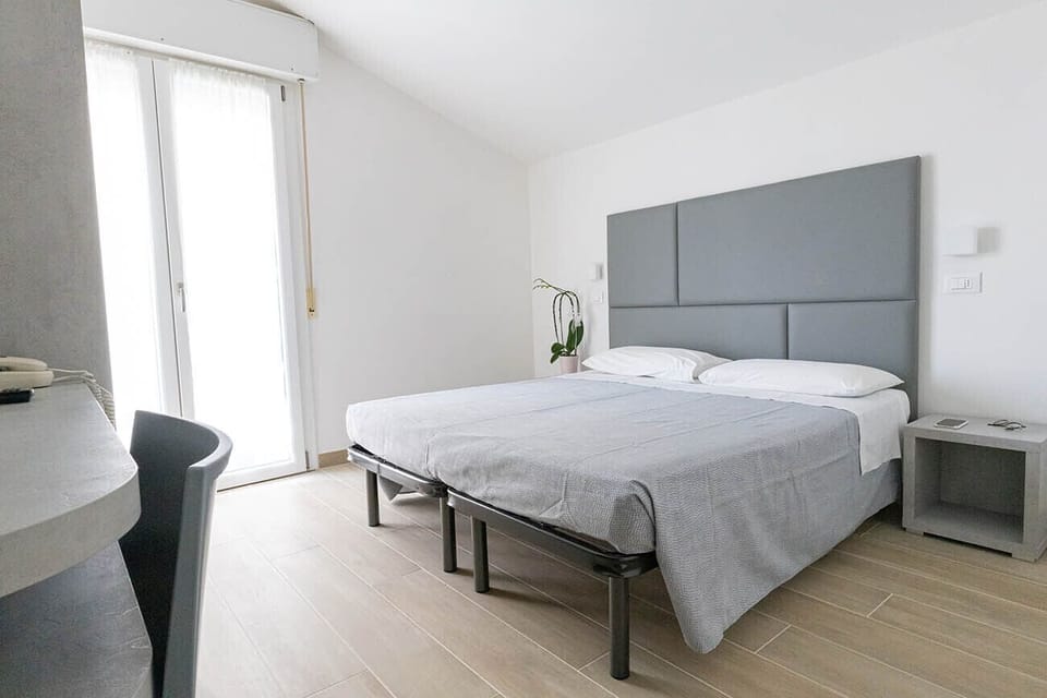 Double or Twin Room, Balcony | In-room safe, desk, iron/ironing board, free WiFi