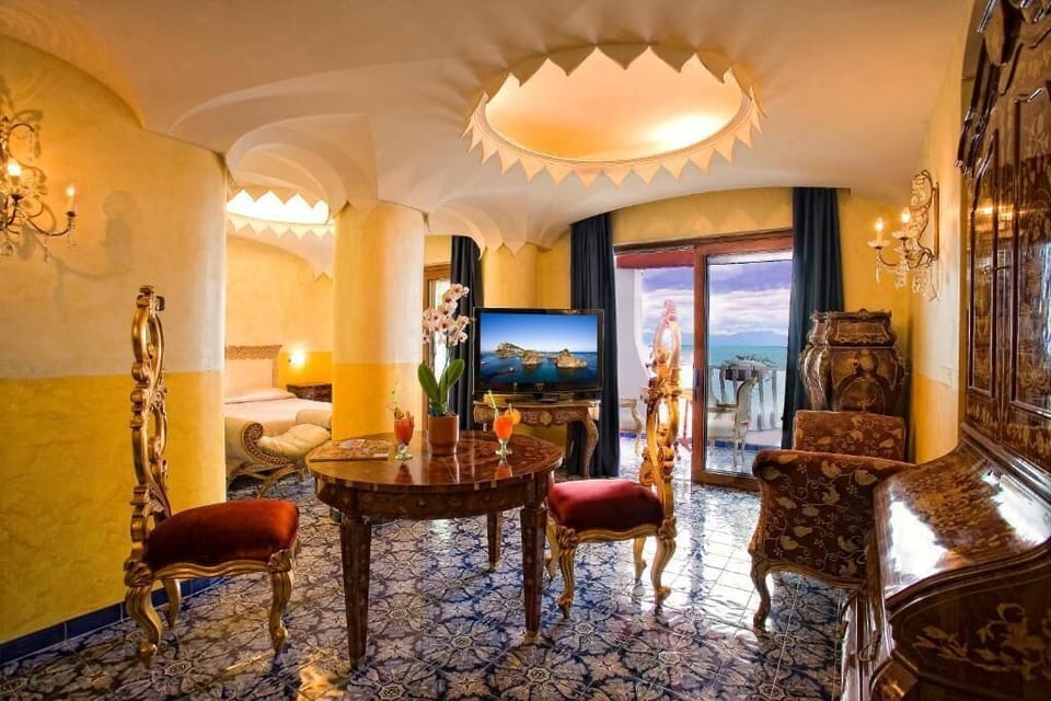 Deluxe Suite, Balcony | Minibar, in-room safe, desk, blackout drapes