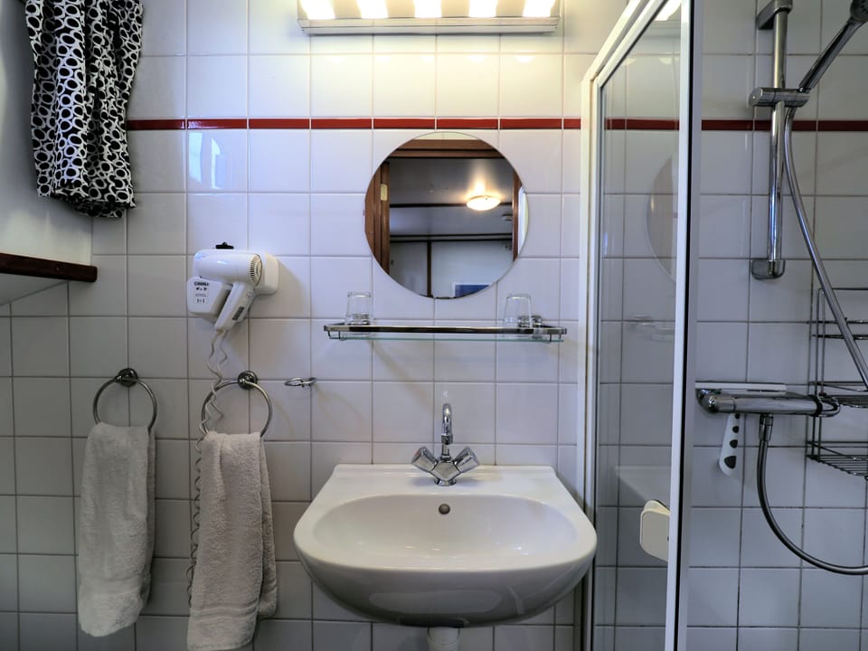 Shower, free toiletries, hair dryer, towels