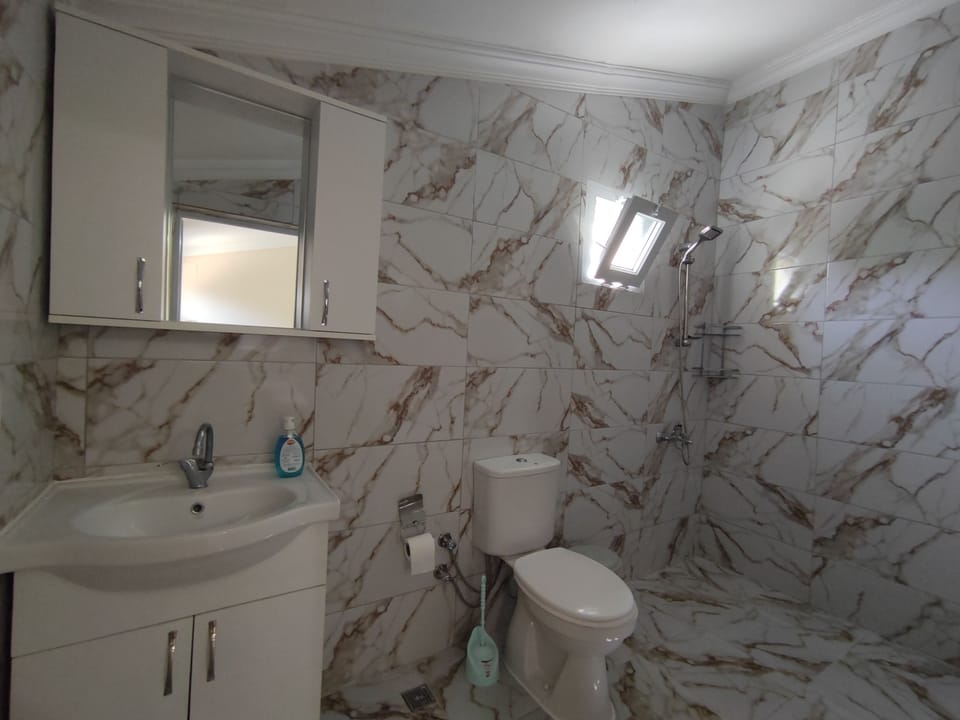 Economy Double Room | Bathroom | Shower, hair dryer, slippers, towels