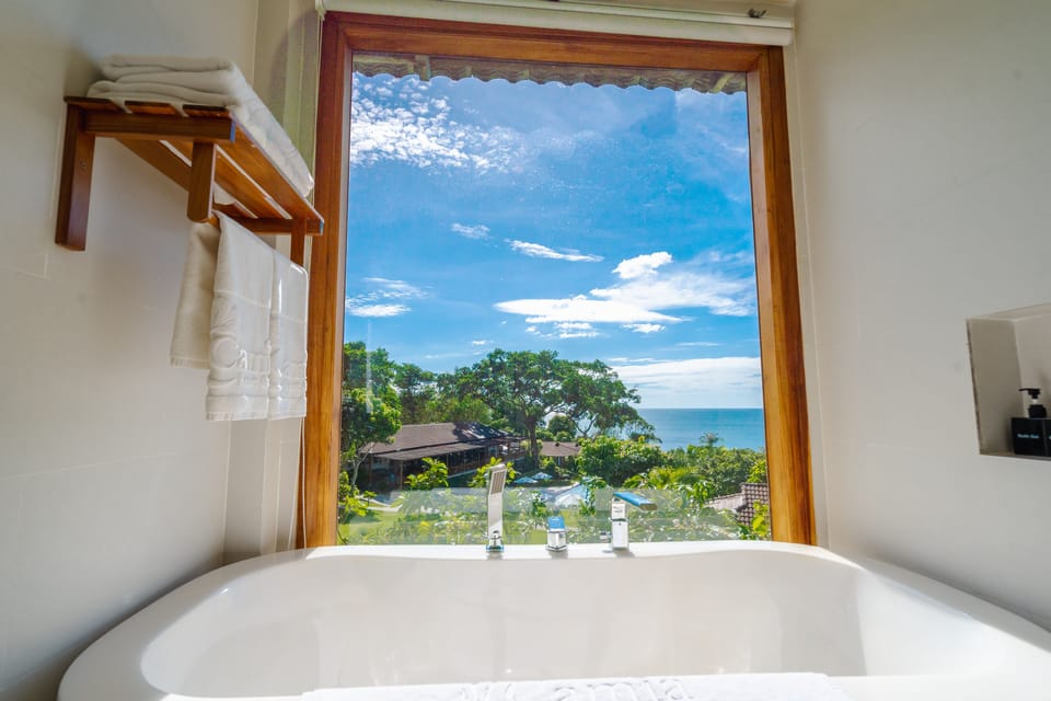 Premium Deluxe Ocean View | Bathroom | Separate tub and shower, free toiletries, hair dryer, bathrobes