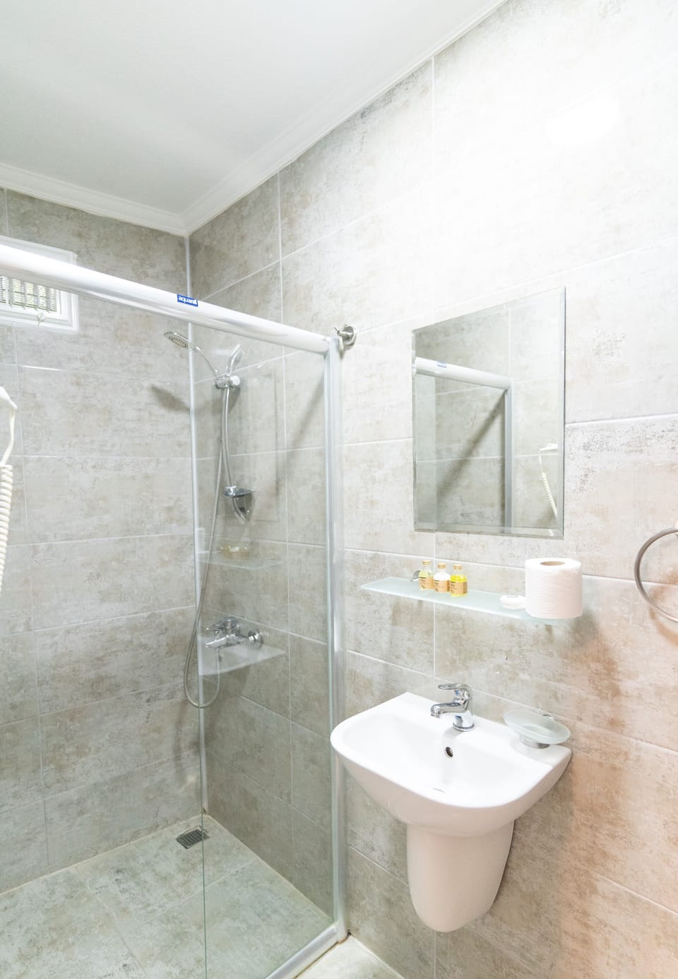 Shower, free toiletries, hair dryer, slippers