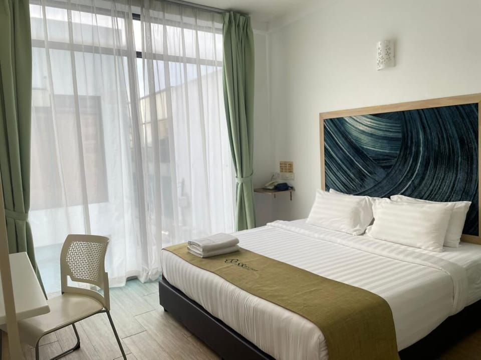 Deluxe Room, 1 King Bed | Desk, iron/ironing board, WiFi (free), bed sheets