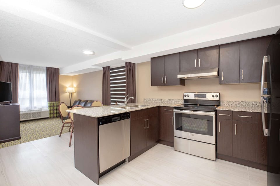 Room, 2 Queen Beds, Non Smoking (Deluxe Efficiency Room) | Private kitchen | Coffee/tea maker, fridge, microwave