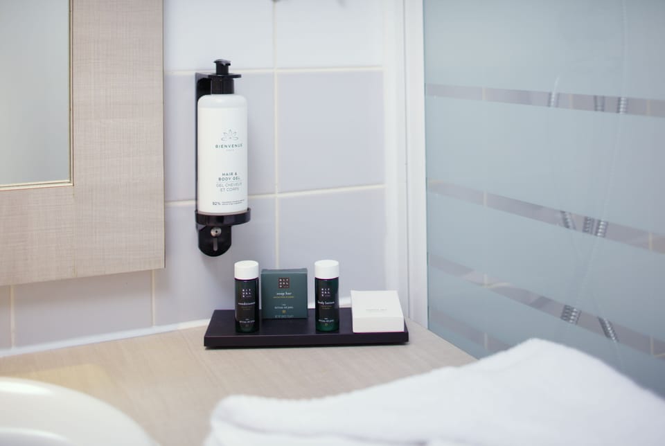 Rainfall showerhead, eco-friendly toiletries, hair dryer, towels
