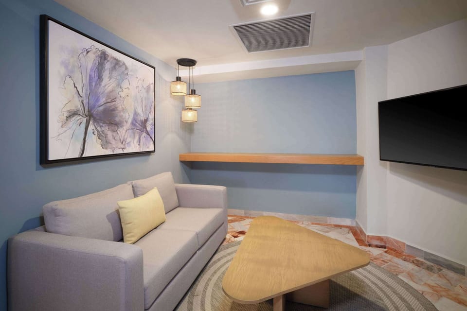 Executive Suite, 1 King Bed - Non-smoking | Living area | 50-inch Smart TV with cable channels, TV, first-run movies