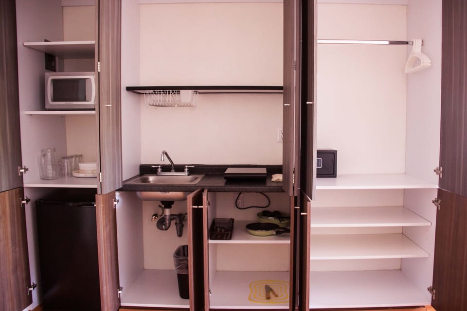 Fridge, microwave, stovetop, coffee/tea maker