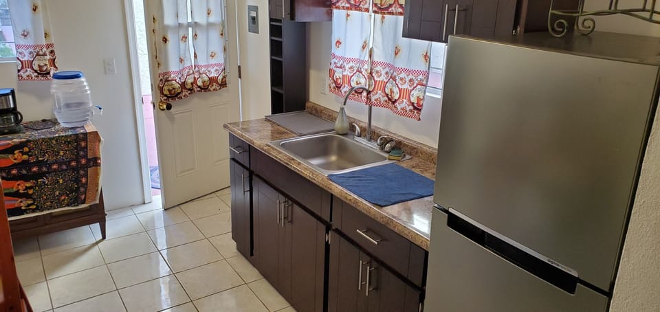 Executive Apartment, Multiple Beds, Kitchen, Garden Area | Private kitchen | Fridge
