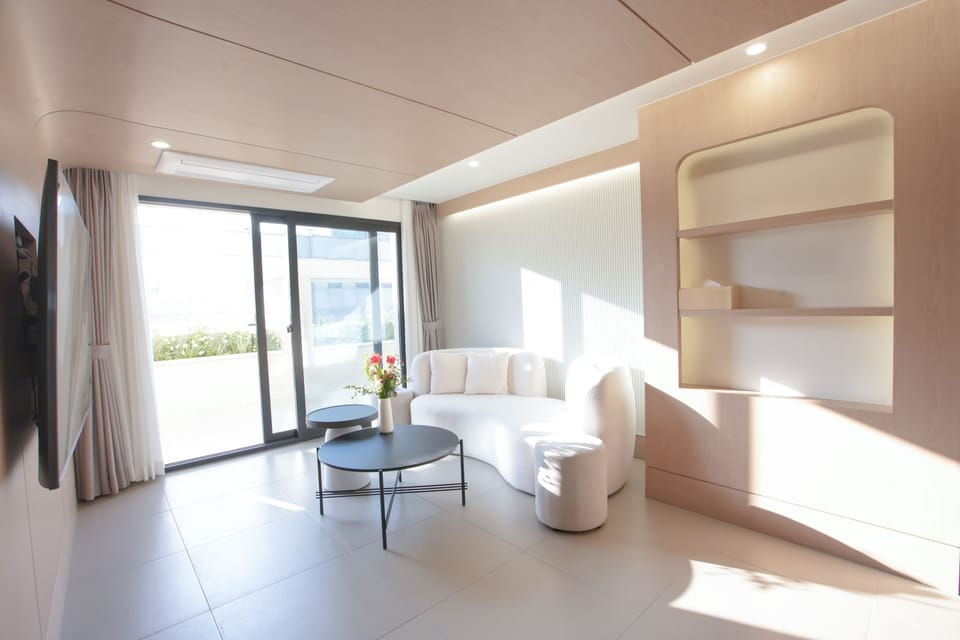 Presidential Studio Suite, Multiple Beds, Hot Tub | Living area | 65-inch flat-screen TV with cable channels, Netflix, heated floors