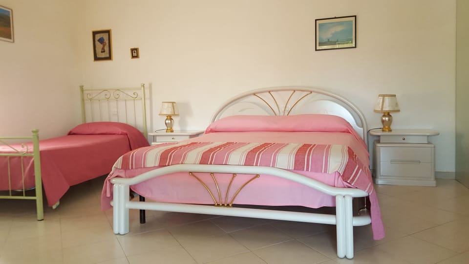 Basic Triple Room, Garden View | Desk, iron/ironing board, free WiFi, bed sheets