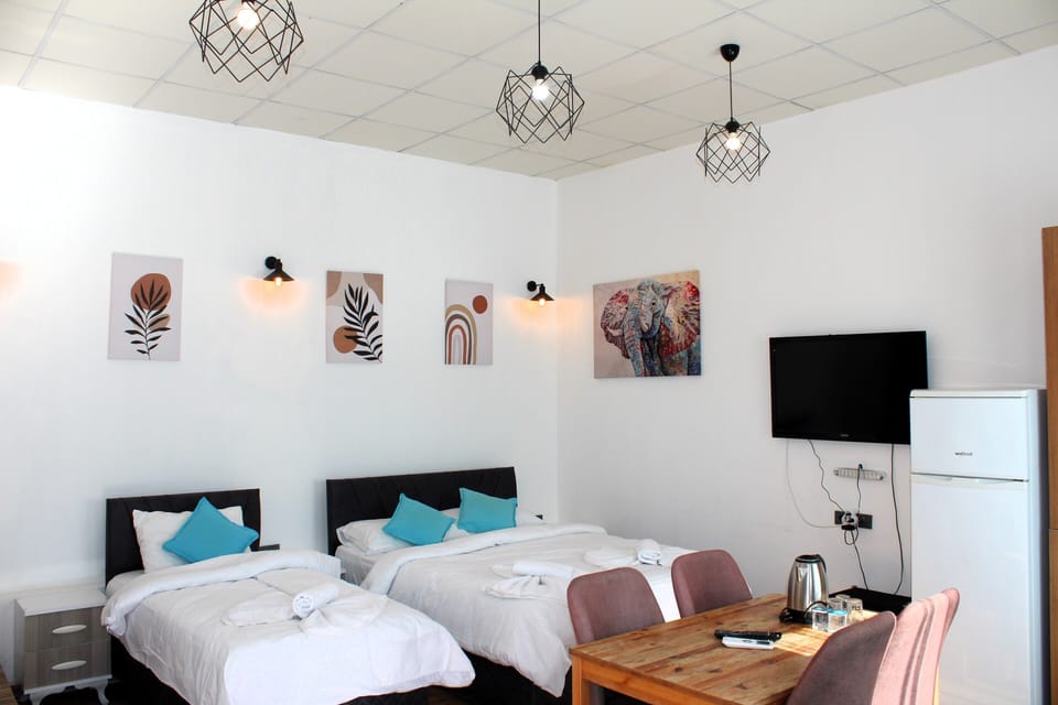 Economy Room, Multiple Beds, Patio, Garden View | Individually decorated, individually furnished, desk, laptop workspace