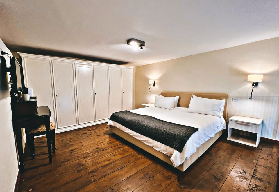 Deluxe Quadruple Room, 1 King Bed | Premium bedding, down comforters, minibar, in-room safe